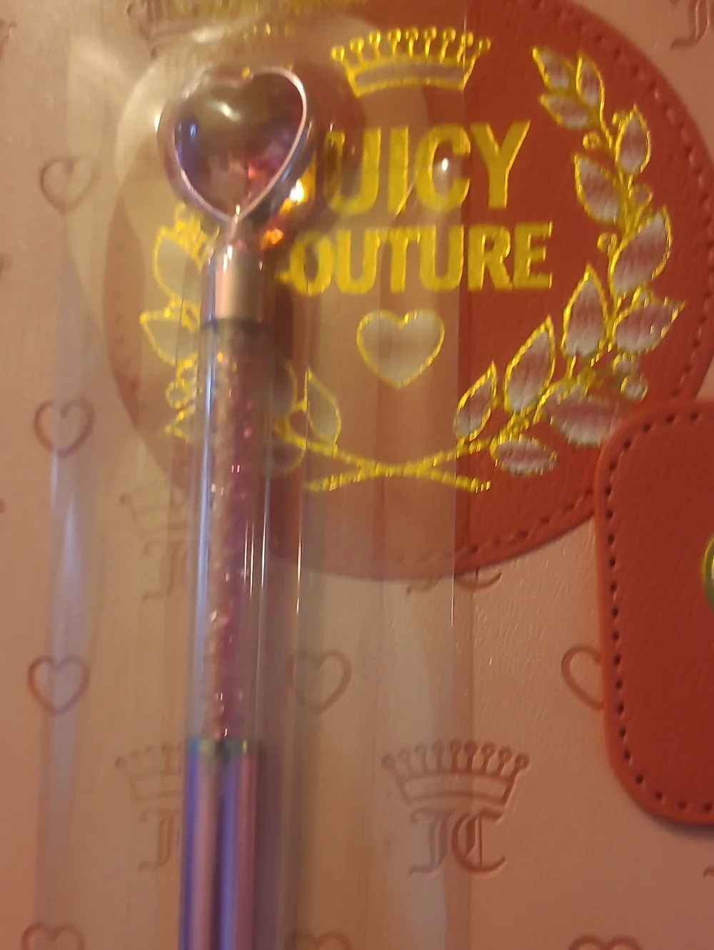 Juicy Couture branded closure